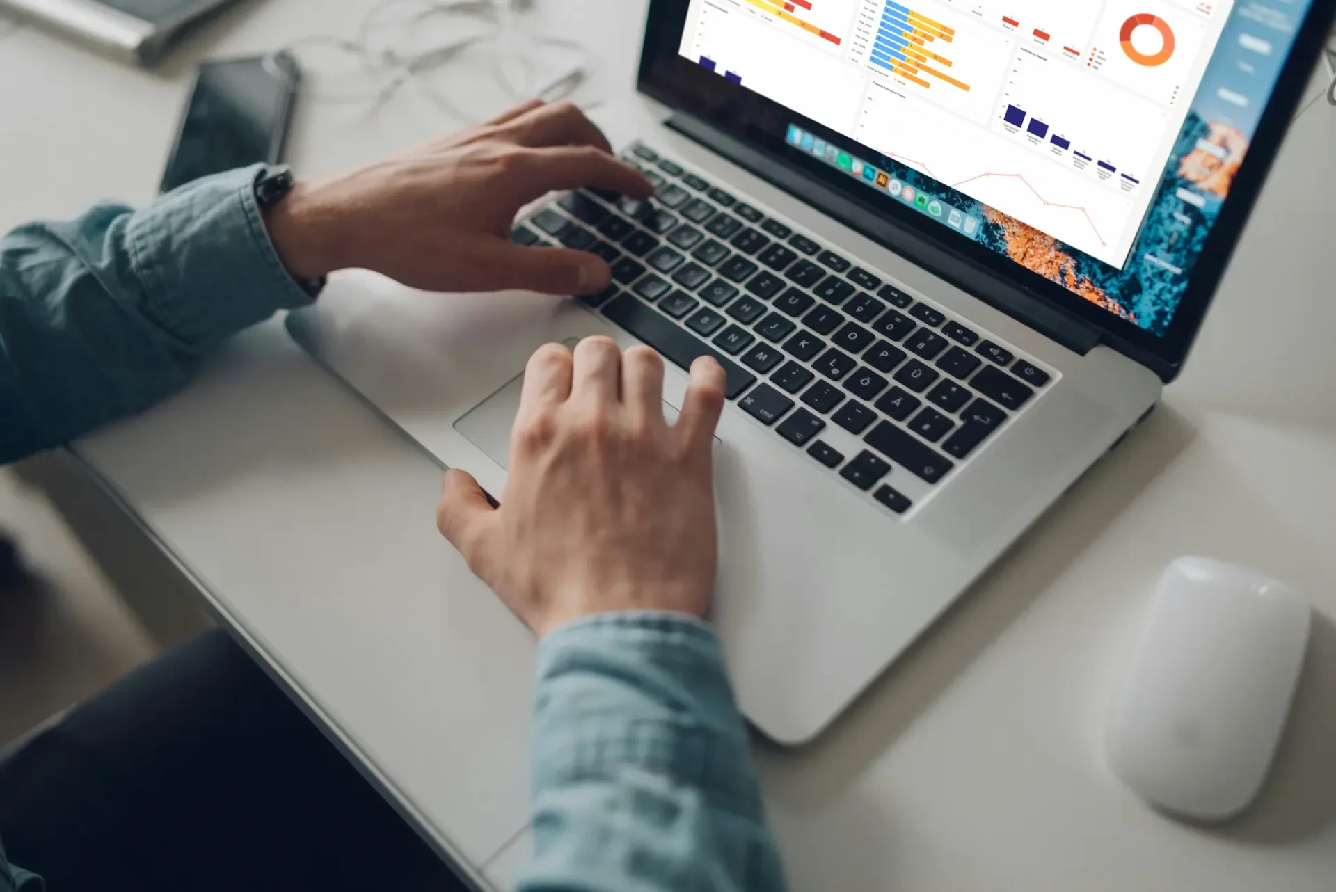 Person working with clew dashboard on laptop at desk